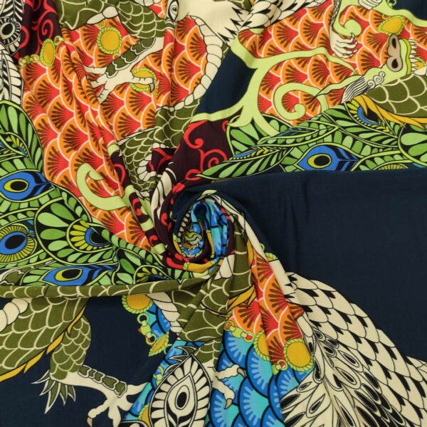 Tessuto Jersey a fantasia motivo astratto verde - blu - arancione - rosso - turchese