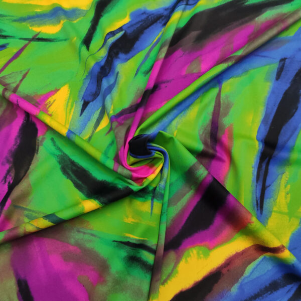 Tessuto Jersey a fantasia motivo astratto verde fluo - viola - blu - giallo