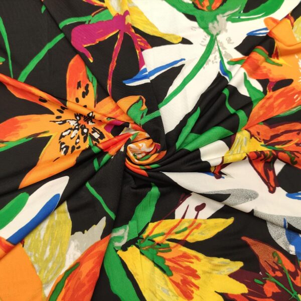 Tessuto Jersey a fantasia motivo floreale nero - verde - arancione - bianco