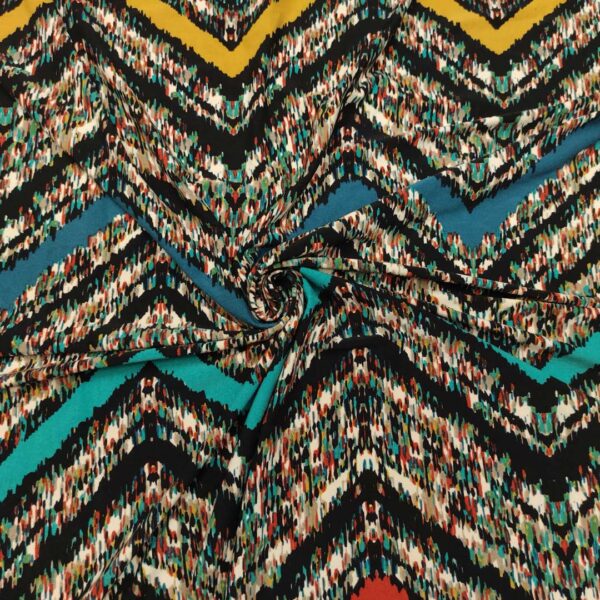 Tessuto Jersey a fantasia motivo geometrico turchese - ocra - ruggine - petrolio