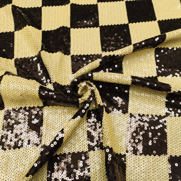 Tessuto Jersey ricamato con paillettes motivo geometrico nero - giallo