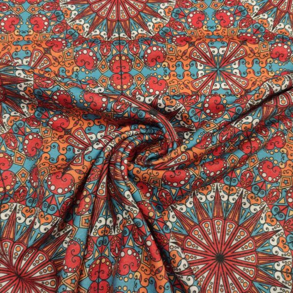 Tessuto Maglia Mano Lana a fantasia motivo astratto turchese - arancione