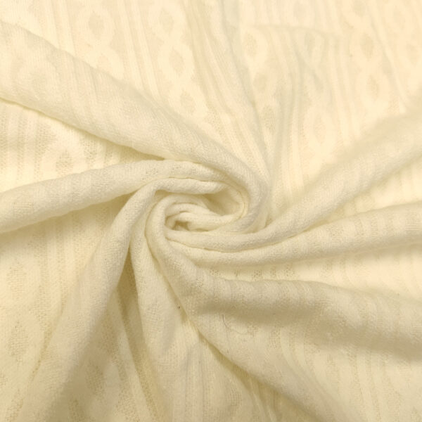 Tessuto Maglia Mano lana in tinta unita motivo treccia bianco