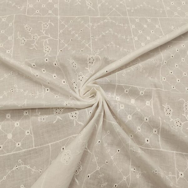 Tessuto Mussola di Cotone ricamato motivo astratto bianco seta
