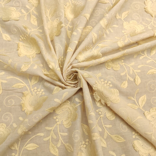 Tessuto Mussola di Cotone ricamato motivo floreale beige - giallino