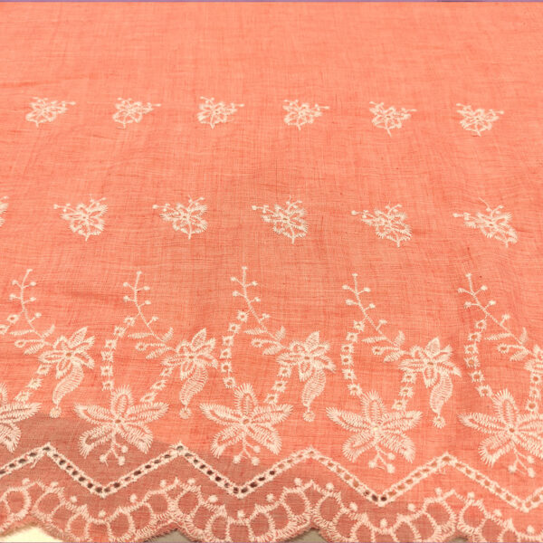 Tessuto Mussola di Cotone ricamato tinta unita corallo