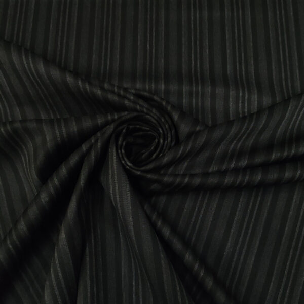 Tessuto pettinato elasticizzato in lana motivo rigato nero - grigio antracite