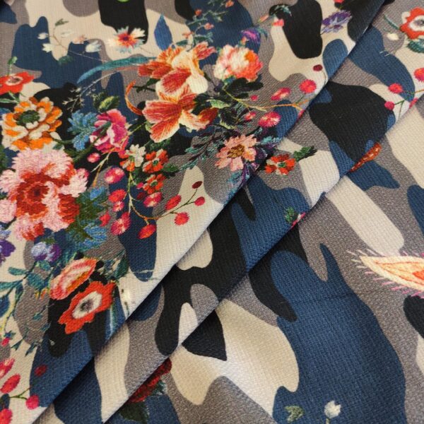 Tessuto Piquet di cotone a fantasia motivo floreale rosso - blu - nero