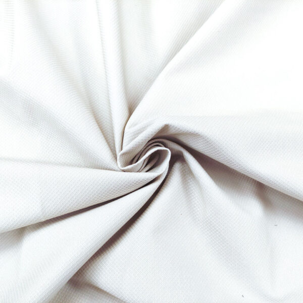 Tessuto piquet di cotone elasticizzato tinta unita bianco seta