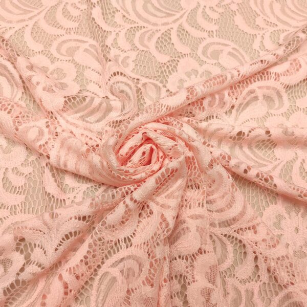 Tessuto pizzo elasticizzato doppio smerlo motivo astratto tinta unita pesco