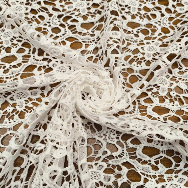 Tessuto Pizzo macramè motivo floreale bianco seta