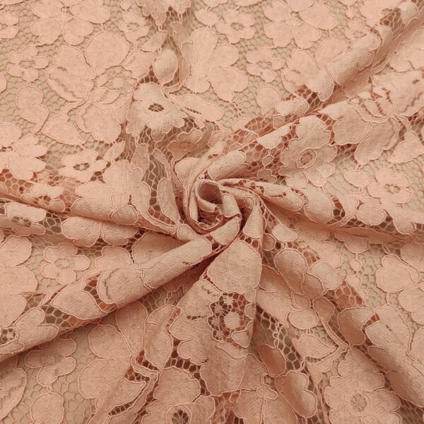 Tessuto Pizzo Rebrodè tinta unita motivo floreale rosa cipria