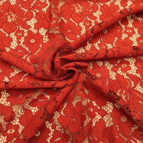 Tessuto Pizzo Rebrodè tinta unita motivo floreale ruggine