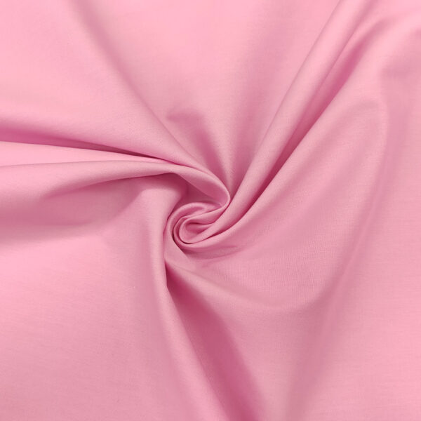 Tessuto Popeline di cotone in tinta unita rosa baby