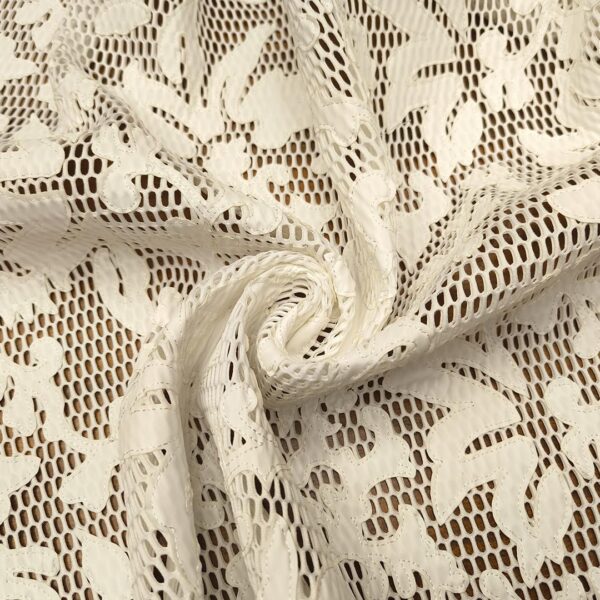 Tessuto Rete con applicazioni motivo floreale in ecopelle tinta unita bianco