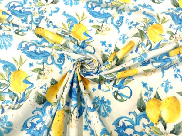 Tessuto Sangallo a fantasia motivo floreale bianco - azzurro - giallo