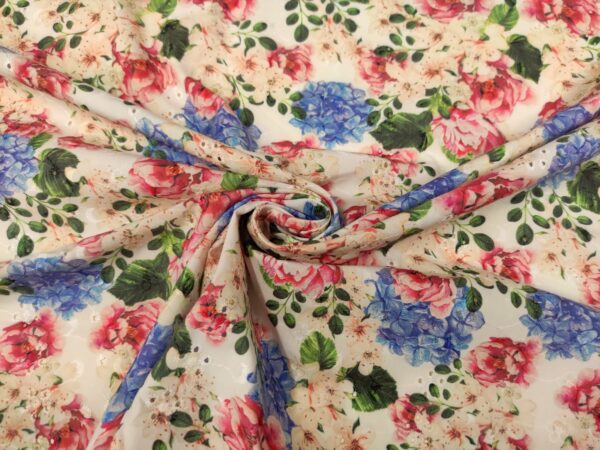 Tessuto Sangallo a fantasia motivo floreale bianco - lilla - rosa - verde