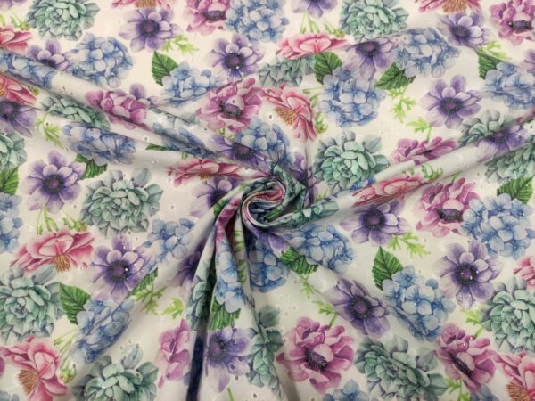 Tessuto Sangallo a fantasia motivo floreale bianco - lilla - verde