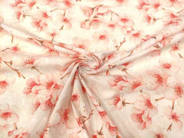 Tessuto Sangallo a fantasia motivo floreale bianco - rosa