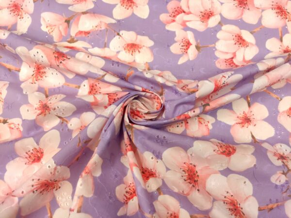 Tessuto Sangallo a fantasia motivo floreale lilla - rosa
