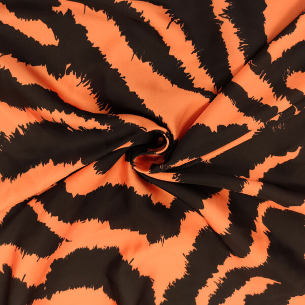 Tessuto Satin a fantasia motivo animalier nero - arancione