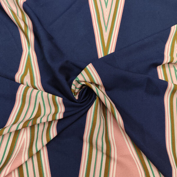 Tessuto Crepe elasticizzato a fantasia motivo astratto blu - rosa