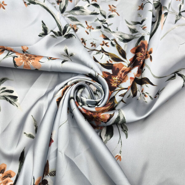 Tessuto Satin a fantasia motivo floreale celeste nube - ruggine - verde