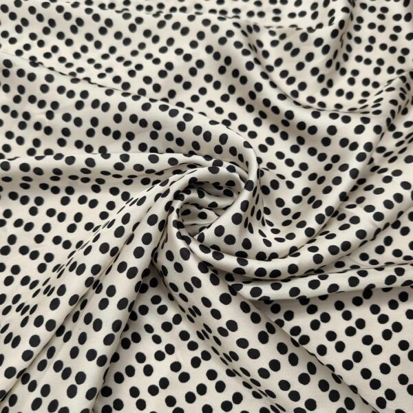 Tessuto Satin a fantasia motivo pois piccoli panna - nero