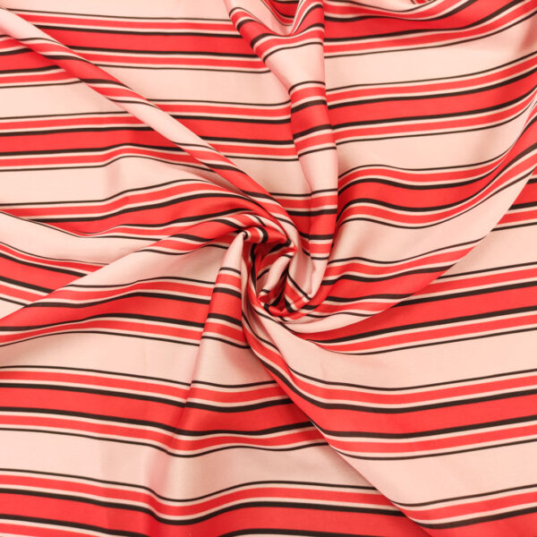 Tessuto Satin a fantasia motivo rigato rosa - corallo - nero