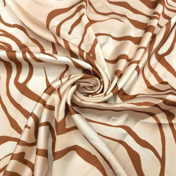 Tessuto Satin a fantasia motivo animalier ruggine - panna