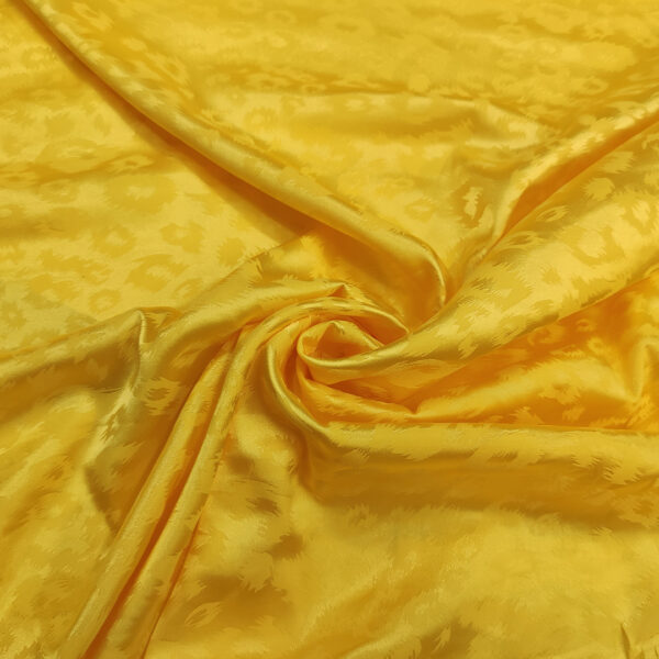 Tessuto satin elasticizzato a fantasia motivo animalier giallo