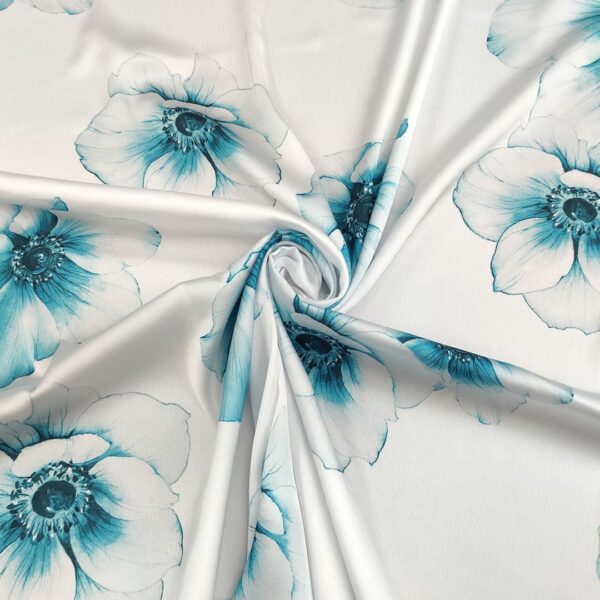 Tessuto Satin a fantasia motivo floreale bianco - turchese