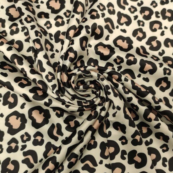 Tessuto Satin elasticizzato a fantasia motivo animalier rosa - panna - nero