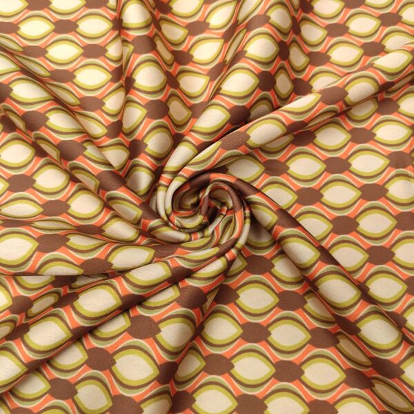 Tessuto Satin elasticizzato a fantasia motivo geometrico arancio - lime - panna