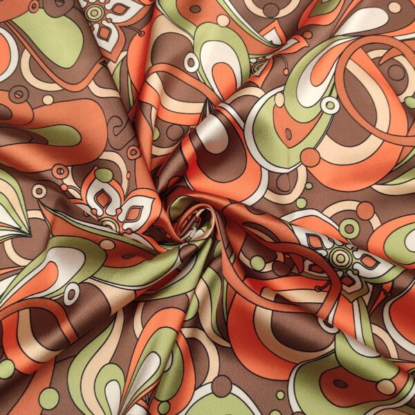 Tessuto Satin elasticizzato a fantasia motivo astratto arancio - marrone - verdino