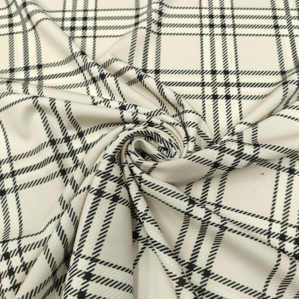 Tessuto scuba crepe a fantasia motivo quadri nero - bianco