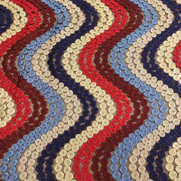 Tessuto Tulle ricamato motivo astratto blu - rosso - beige