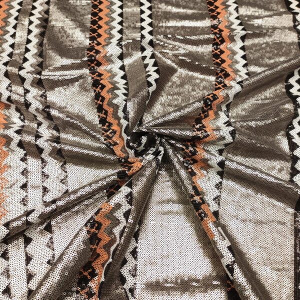 Tessuto Tulle ricamato con paillettes motivo geometrico arancione - nero - bianco