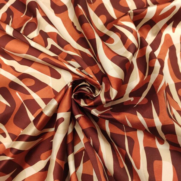 Tessuto Twill a fantasia motivo animalier ruggine - panna - bordeaux