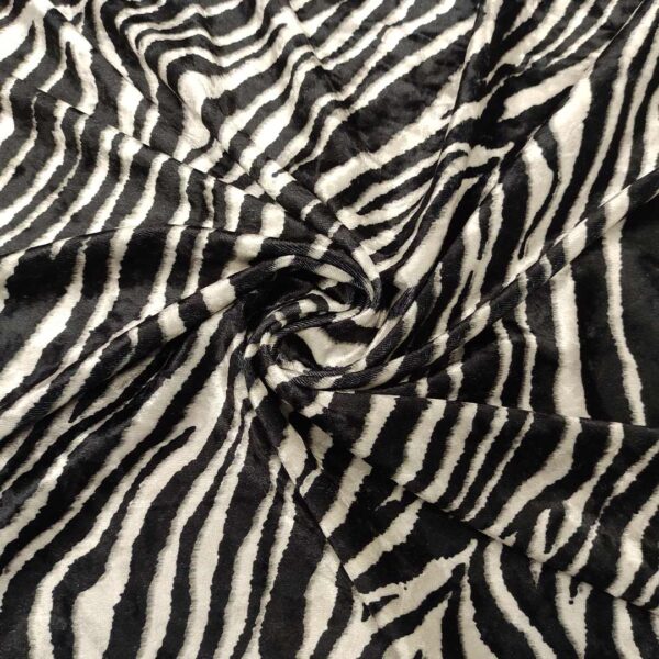 Tessuto Velluto elasticizzato a fantasia motivo animalier bianco - nero