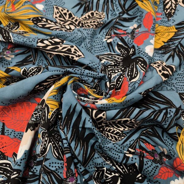 Tessuto Viscosa a fantasia motivo floreale celeste - rosso - ocra