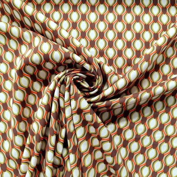 Tessuto Cady elasticizzato a fantasia motivo geometrico verde acido - arancione - marrone