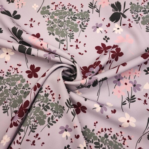 Tessuto Triplo Cady mano lana a fantasia motivo floreale lilla - malva - eucalipto