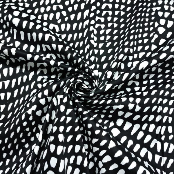 Tessuto Cotone a fantasia motivo astratto bianco - nero
