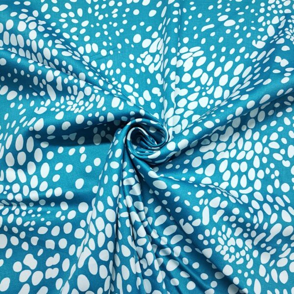 Tessuto Cotone a fantasia motivo astratto bianco - turchese