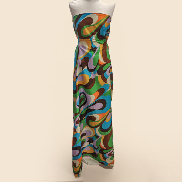 Tessuto Cotone a fantasia motivo astratto verde - marrone - lilla - turchese