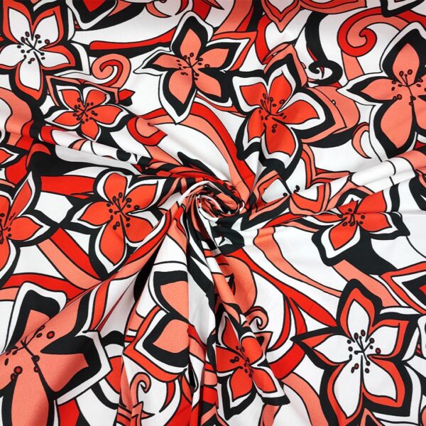 Tessuto Cotone leggero a fantasia motivo astratto bianco - arancione - corallo