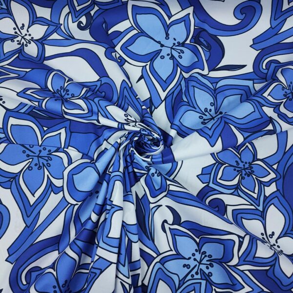 Tessuto Cotone leggero a fantasia motivo astratto bianco - bluette - blu navy