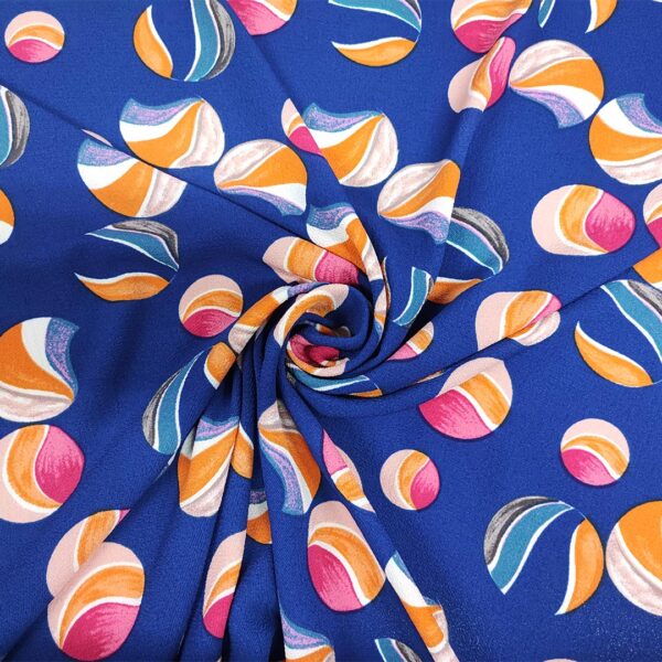 Tessuto Crepe a fantasia motivo astratto bluette - fucsia - arancione