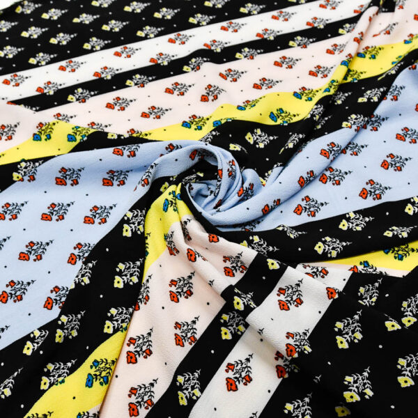 Tessuto Crepe a fantasia motivo astratto giallo - nero - celeste
